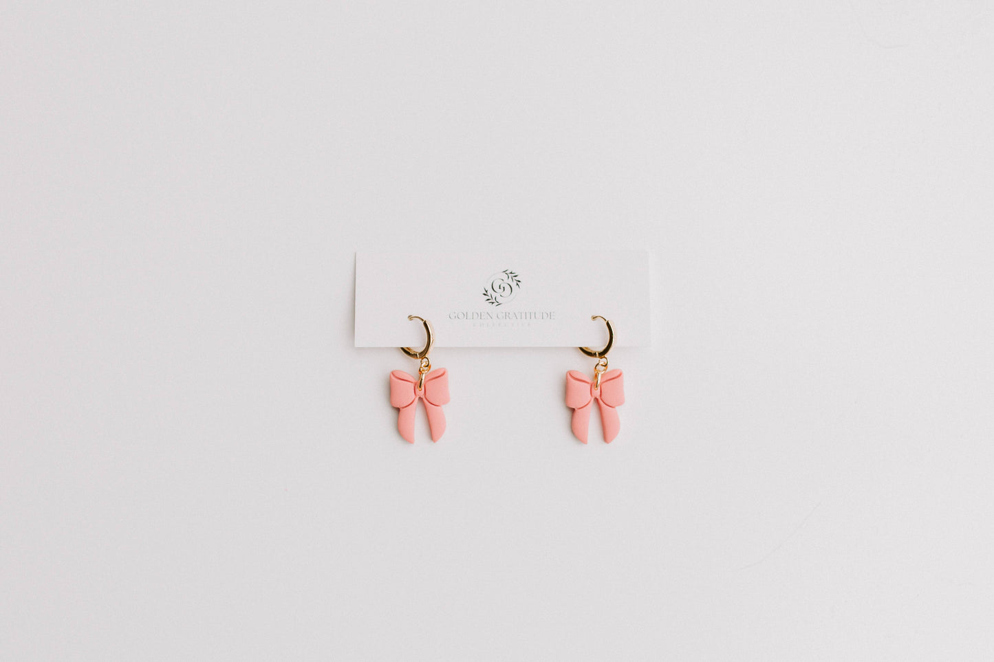 Pink Bow Huggie Earrings